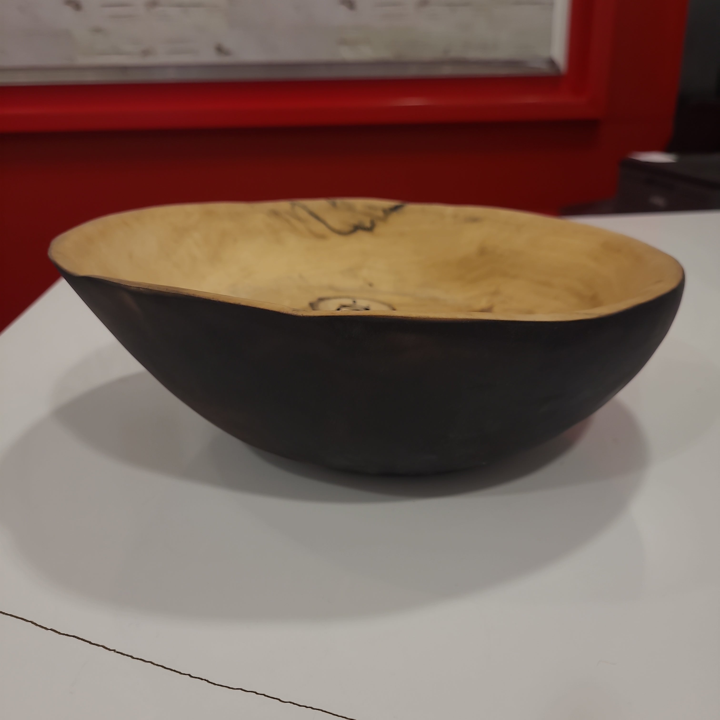 Bent into shape large maple with black bowl
